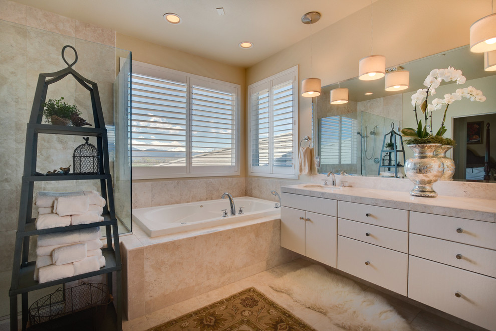 Large traditional master bathroom in Denver with flat-panel cabinets, white cabinets, a corner tub, ceramic tile, beige walls, an undermount sink, granite benchtops and ceramic floors.