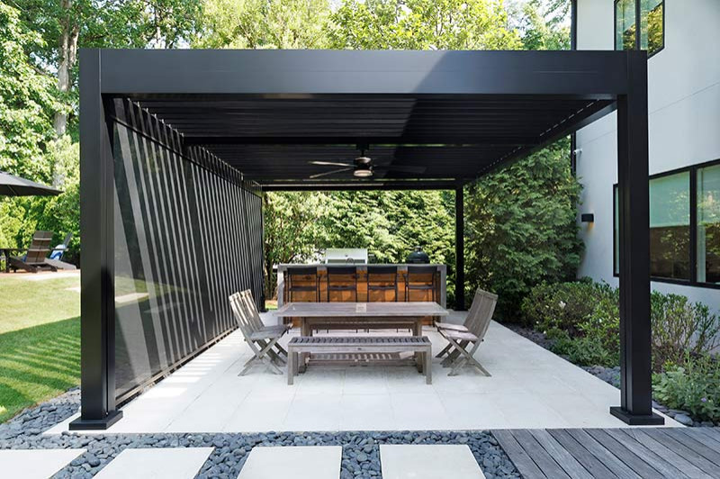 This is an example of a mid-sized modern backyard patio in Atlanta with tile and a pergola.