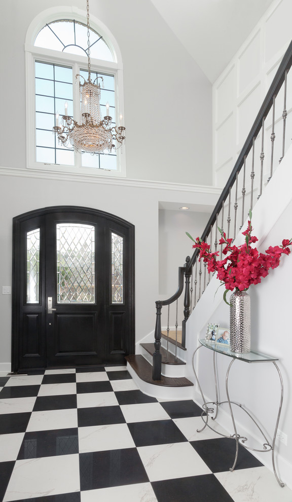 This is an example of a large contemporary foyer in Chicago with grey walls, porcelain floors, a single front door, a black front door and multi-coloured floor.