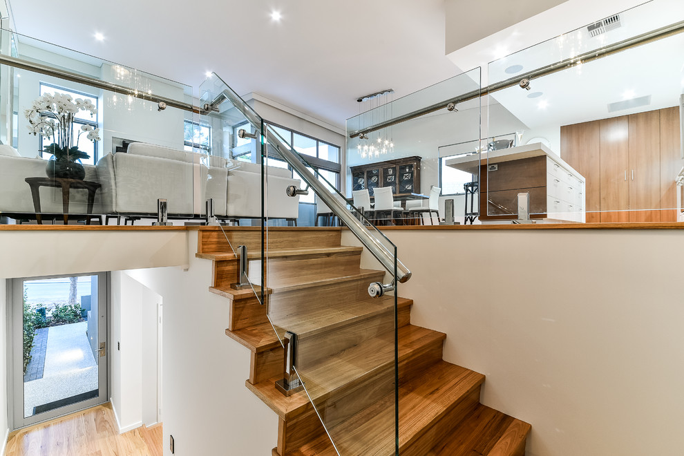 Photo of a mid-sized contemporary wood u-shaped staircase in Perth with wood risers.