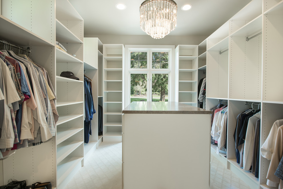 Photo of a large transitional gender-neutral walk-in wardrobe in Seattle with open cabinets, white cabinets, carpet and white floor.