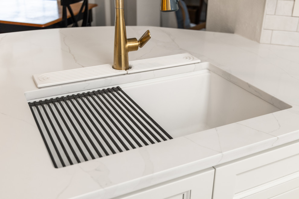 Inspiration for a small transitional l-shaped light wood floor and multicolored floor eat-in kitchen remodel in Tampa with an undermount sink, shaker cabinets, beige cabinets, quartzite countertops, beige backsplash, porcelain backsplash, stainless steel appliances, a peninsula and white countertops