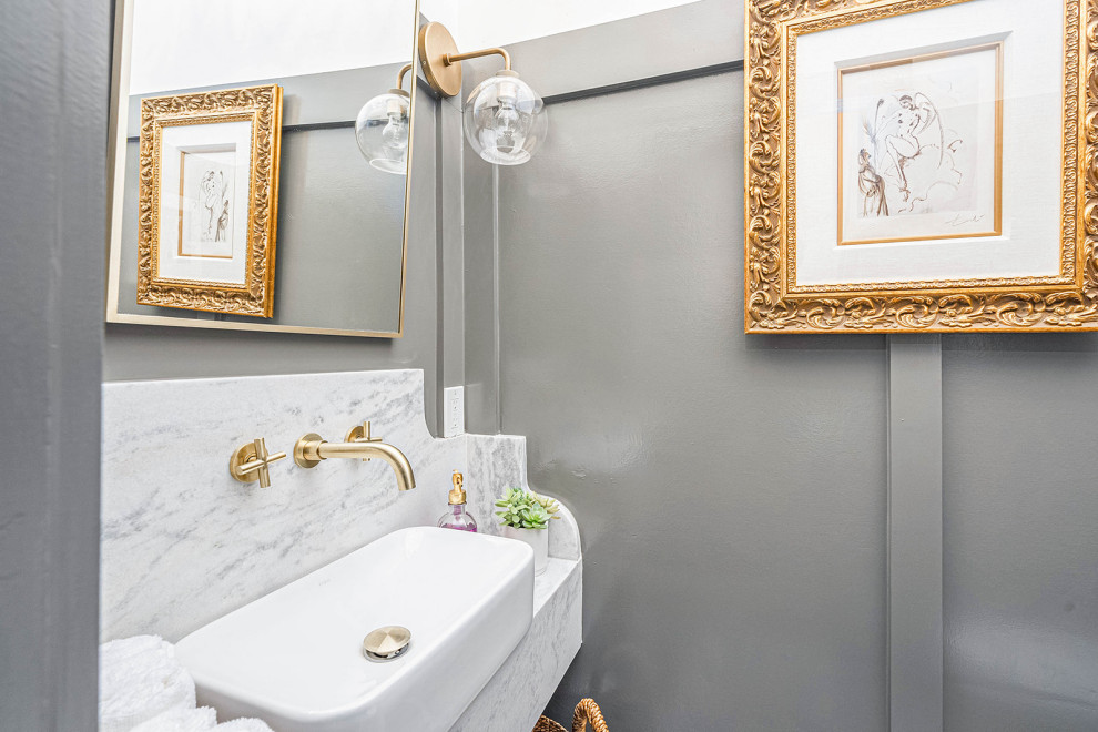 Inspiration for a small victorian cloakroom in Other with a two-piece toilet, grey walls, mosaic tile flooring, a vessel sink, marble worktops, grey floors, grey worktops, a floating vanity unit and panelled walls.