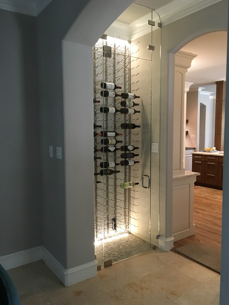 Photo of a small modern wine cellar in Dallas with storage racks.