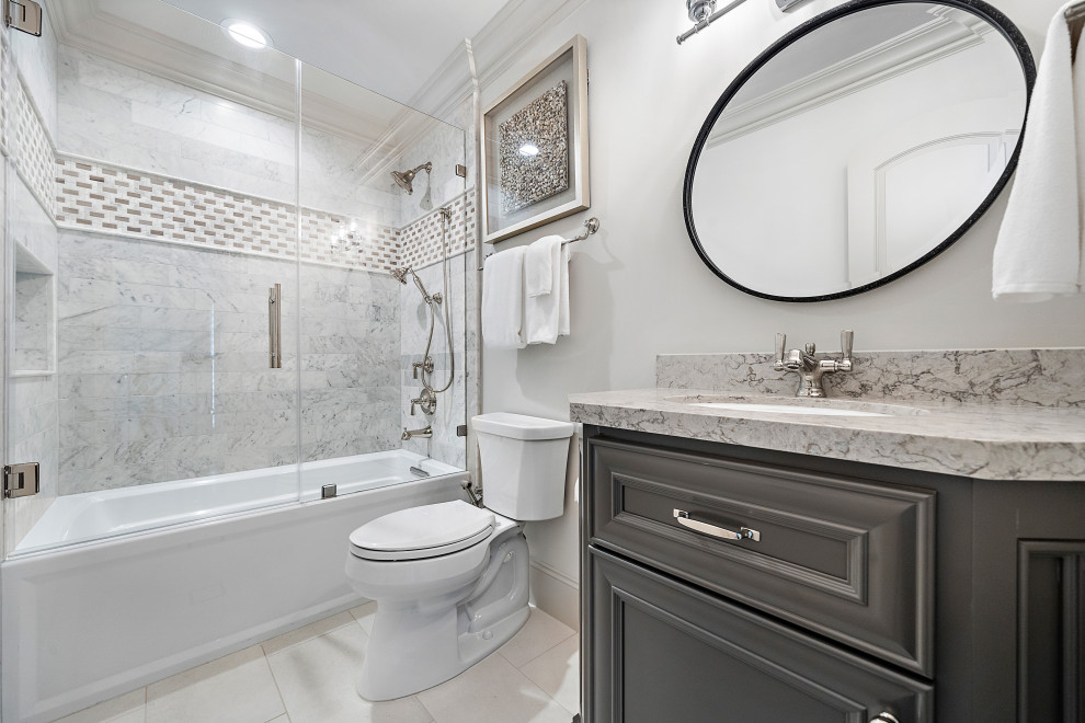 Design ideas for a small traditional bathroom in Houston with recessed-panel cabinets, brown cabinets, an alcove bath, white tiles, marble tiles, white walls, porcelain flooring, a submerged sink, engineered stone worktops, beige floors, a hinged door, beige worktops, a single sink and a freestanding vanity unit.
