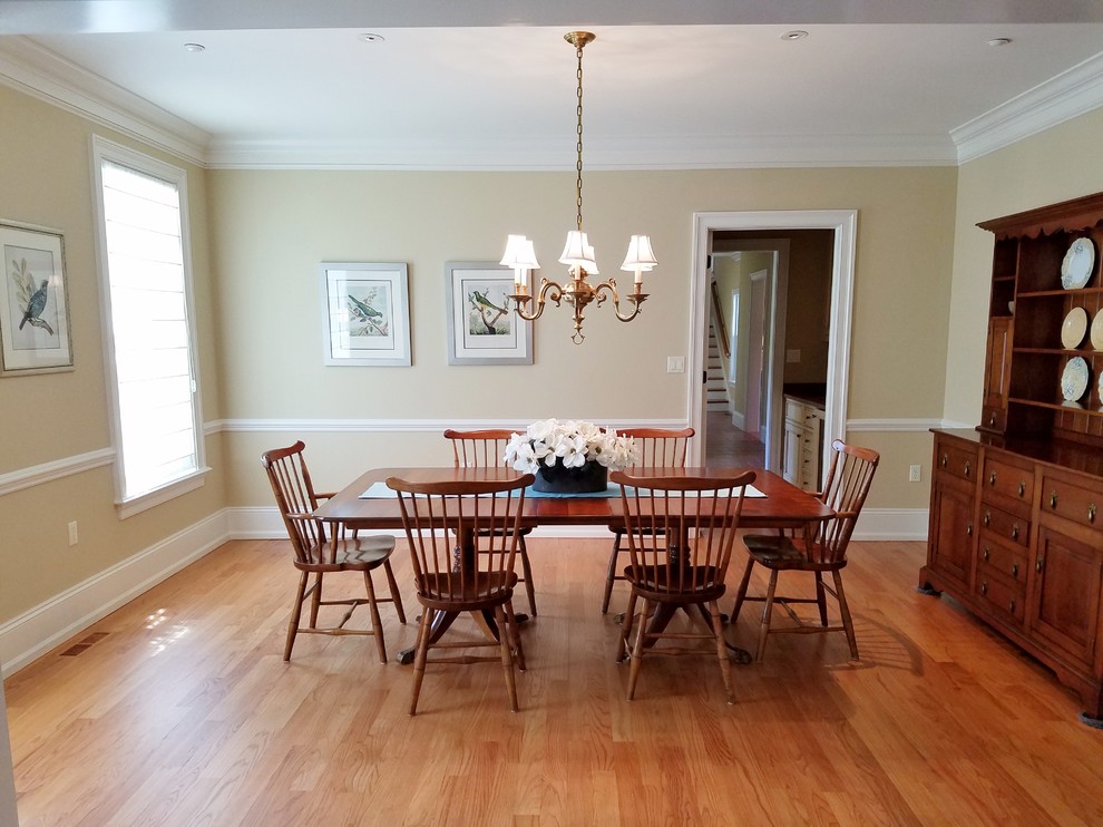 Design ideas for a large traditional separate dining room in Philadelphia with beige walls, light hardwood floors, no fireplace and beige floor.