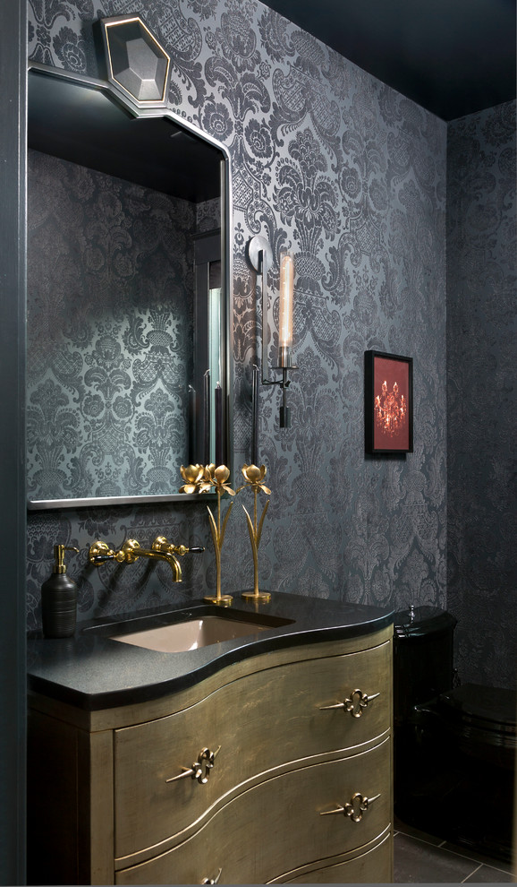 Mid-sized transitional powder room in Denver with furniture-like cabinets, a one-piece toilet, black walls, an undermount sink, solid surface benchtops and black benchtops.