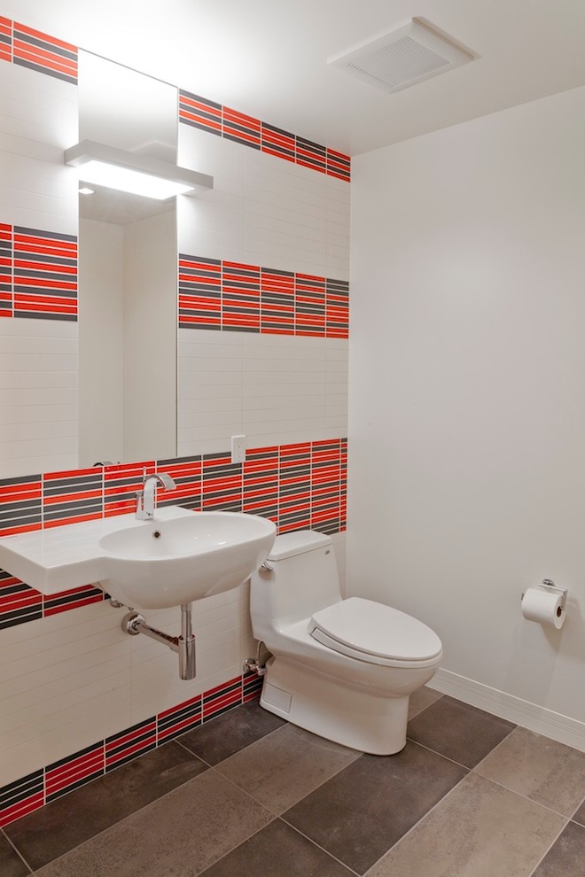 This is an example of a contemporary bathroom in Salt Lake City with a wall-mount sink, multi-coloured tile and multi-coloured walls.