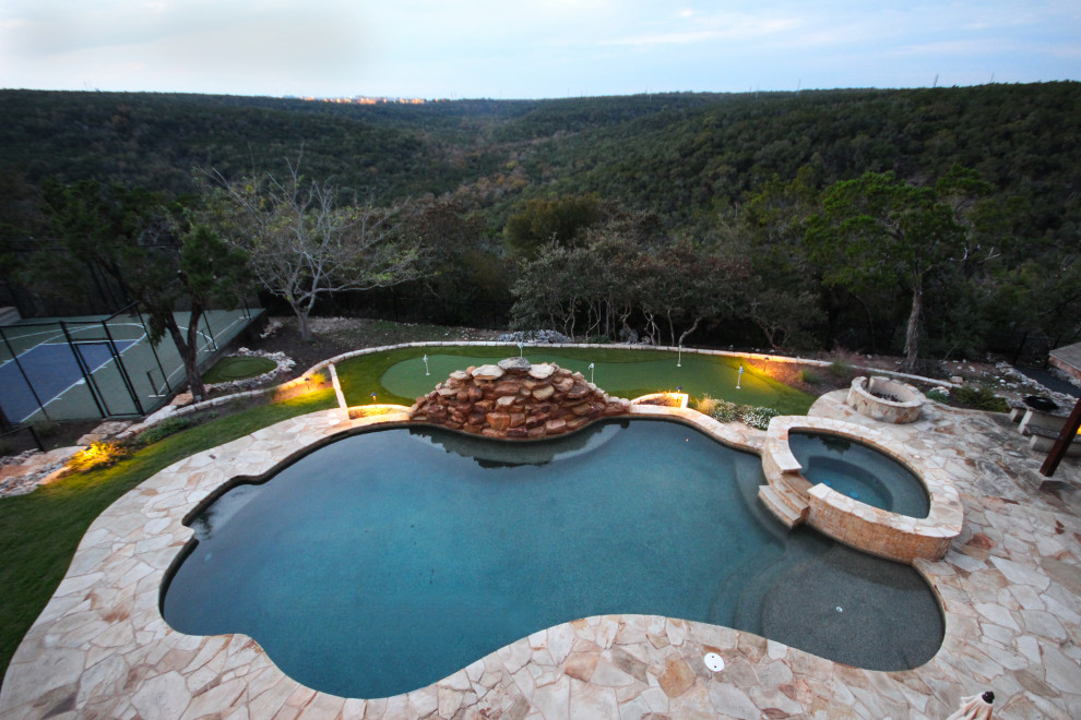 This is an example of an expansive contemporary back garden in Austin.