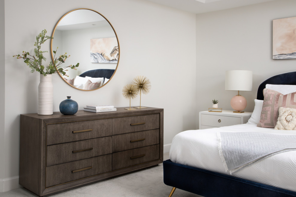 Large modern master bedroom in DC Metro with grey walls, carpet, a two-sided fireplace and grey floor.