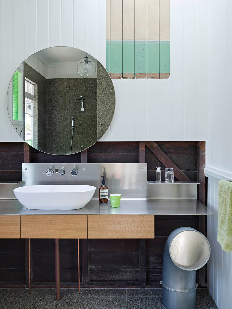 Photo of a modern kids bathroom in Brisbane with light wood cabinets, a vessel sink and stainless steel benchtops.
