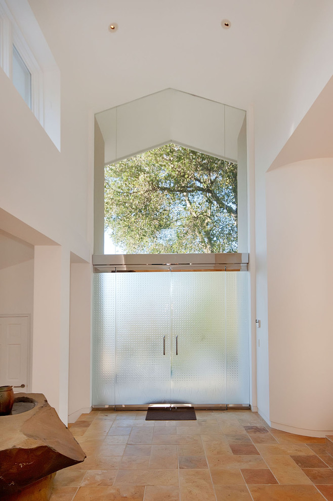 Contemporary entryway in San Francisco with white walls, a double front door and a glass front door.