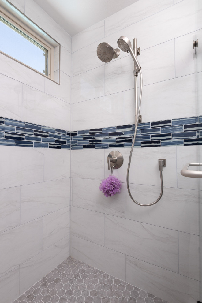 Photo of an expansive traditional ensuite bathroom in San Diego with shaker cabinets, blue cabinets, a corner shower, blue tiles, glass tiles, blue walls, a submerged sink, engineered stone worktops, grey floors, a sliding door, white worktops, a wall niche, double sinks and a freestanding vanity unit.