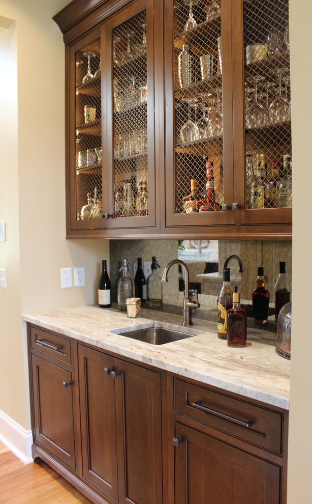 This is an example of a traditional home bar in Other.
