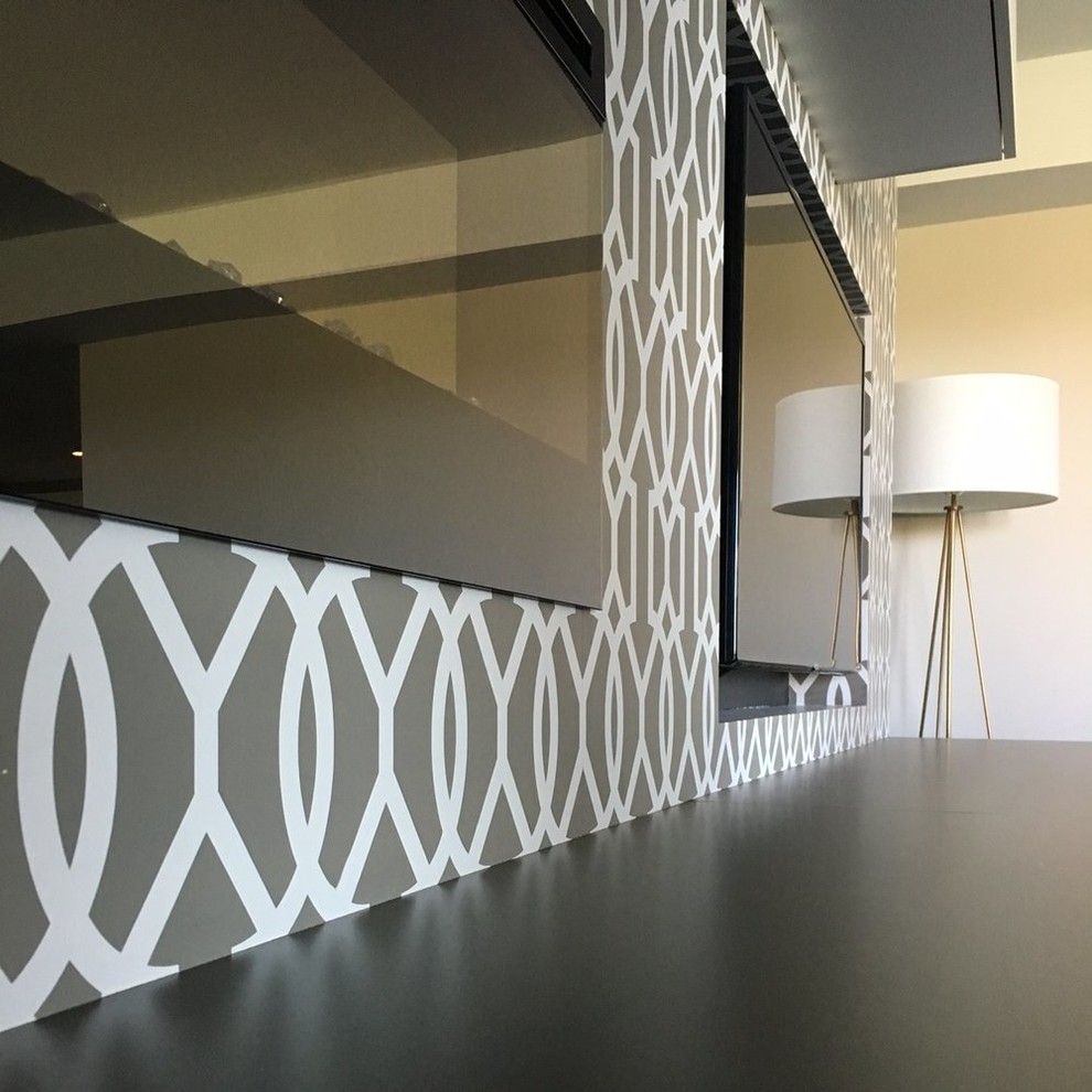 Basement - walk-out carpeted basement idea with a ribbon fireplace