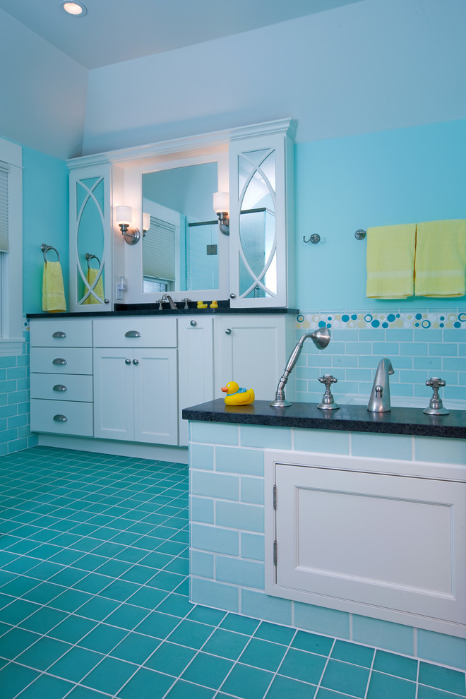 Example of a large transitional kids' blue tile and ceramic tile porcelain tile alcove bathtub design in Minneapolis with flat-panel cabinets, white cabinets, blue walls, an undermount sink and granite countertops