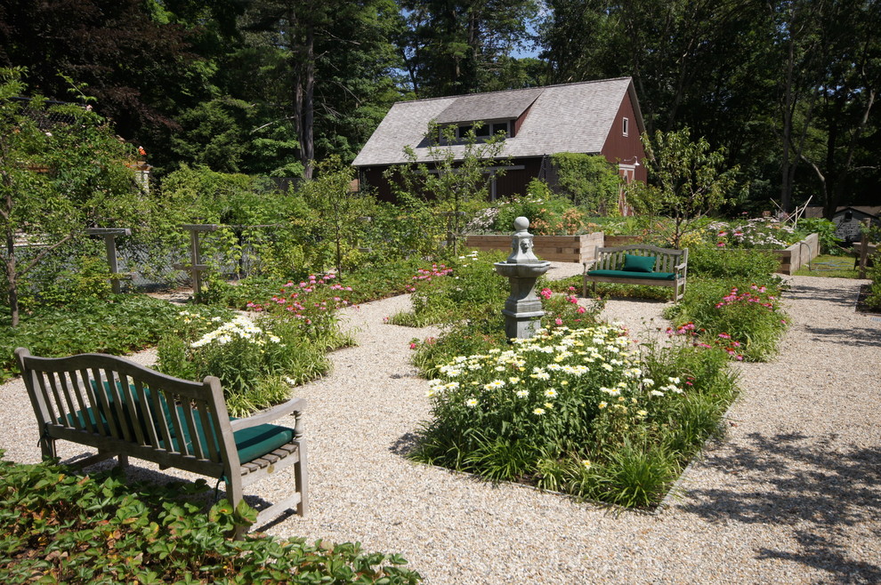 Expansive country backyard full sun formal garden in New York with a water feature and gravel for summer.