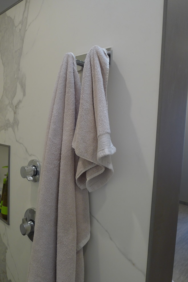 Large transitional master gray tile and porcelain tile porcelain tile home design photo in Indianapolis with a drop-in sink, furniture-like cabinets, dark wood cabinets, solid surface countertops, a one-piece toilet and gray walls