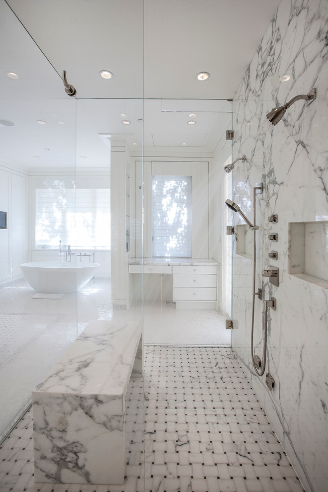 Design ideas for a large transitional master bathroom in Denver with white cabinets, marble benchtops, white tile, white walls, a freestanding tub and a double shower.