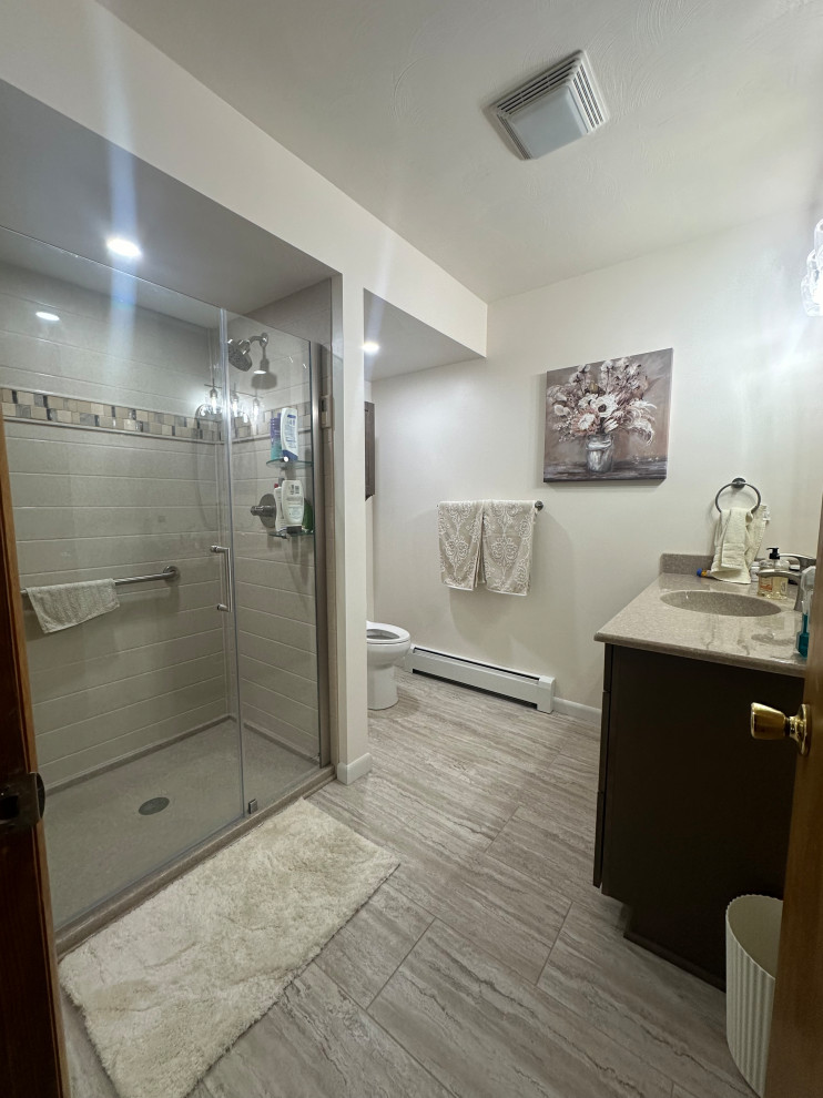 Bathroom Renovation with Glass-Enclosed Shower and Decorative Tile