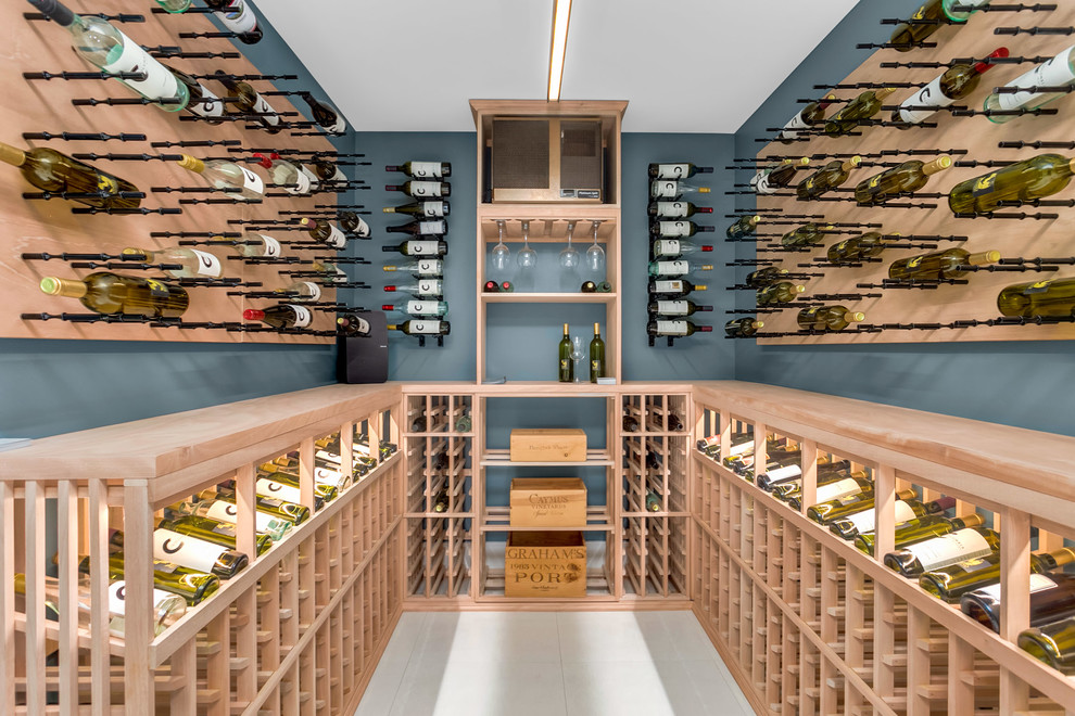 Inspiration for a large contemporary wine cellar in Seattle with ceramic floors, storage racks and white floor.