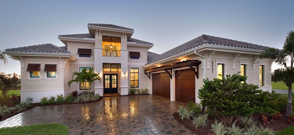 This is an example of a large mediterranean front door in Miami with a double front door and a metal front door.