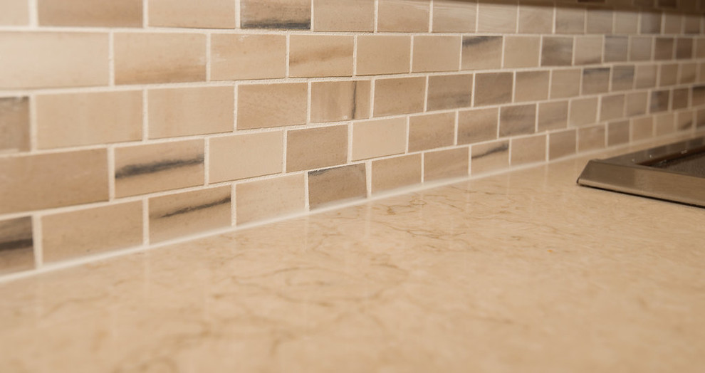 Example of a transitional kitchen design in Denver