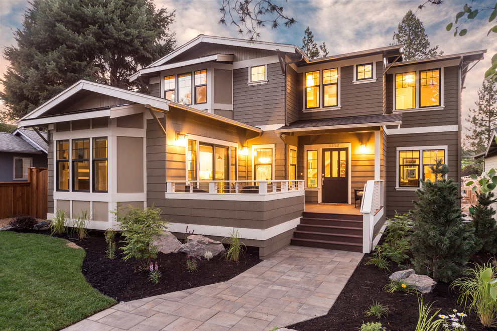 Large traditional two-storey grey exterior in Seattle with wood siding and a gable roof.