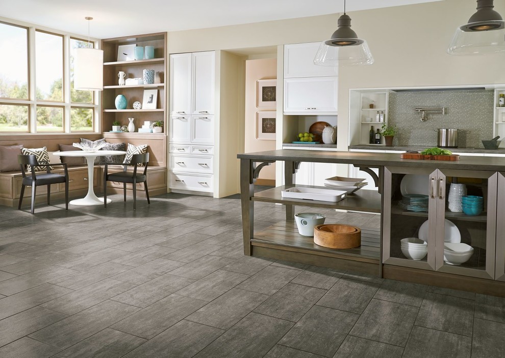 Eat-in kitchen - large transitional galley vinyl floor eat-in kitchen idea in Orange County with recessed-panel cabinets, white cabinets, gray backsplash, stainless steel appliances and an island