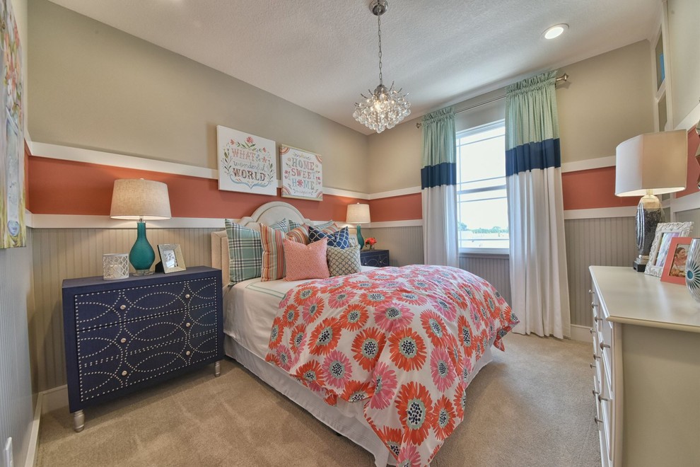 This is an example of a mid-sized traditional kids' room for girls in Orlando with carpet, multi-coloured walls and beige floor.