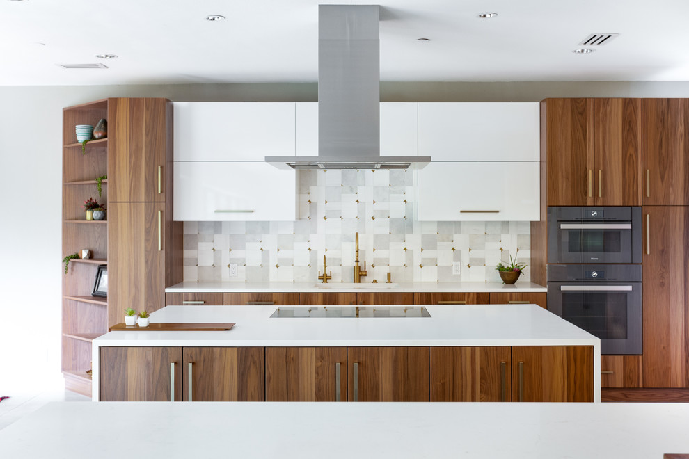 Photo of an expansive modern galley eat-in kitchen in Dallas with a single-bowl sink, flat-panel cabinets, medium wood cabinets, quartz benchtops, grey splashback, marble splashback, stainless steel appliances, porcelain floors, multiple islands, grey floor and white benchtop.