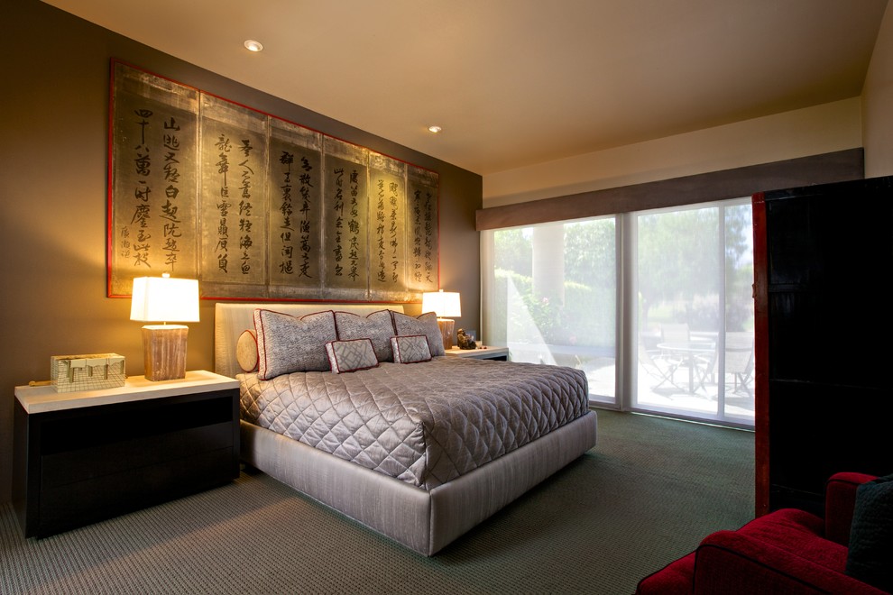 This is an example of a large asian master bedroom in Los Angeles with beige walls, carpet and no fireplace.