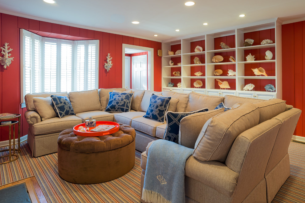 This is an example of a mid-sized beach style formal living room in New York with red walls, carpet and a standard fireplace.