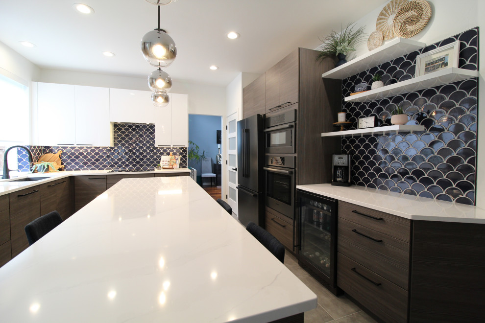 Mid-sized minimalist l-shaped ceramic tile and gray floor open concept kitchen photo in Seattle with an undermount sink, flat-panel cabinets, dark wood cabinets, quartz countertops, blue backsplash, mosaic tile backsplash, black appliances, an island and white countertops