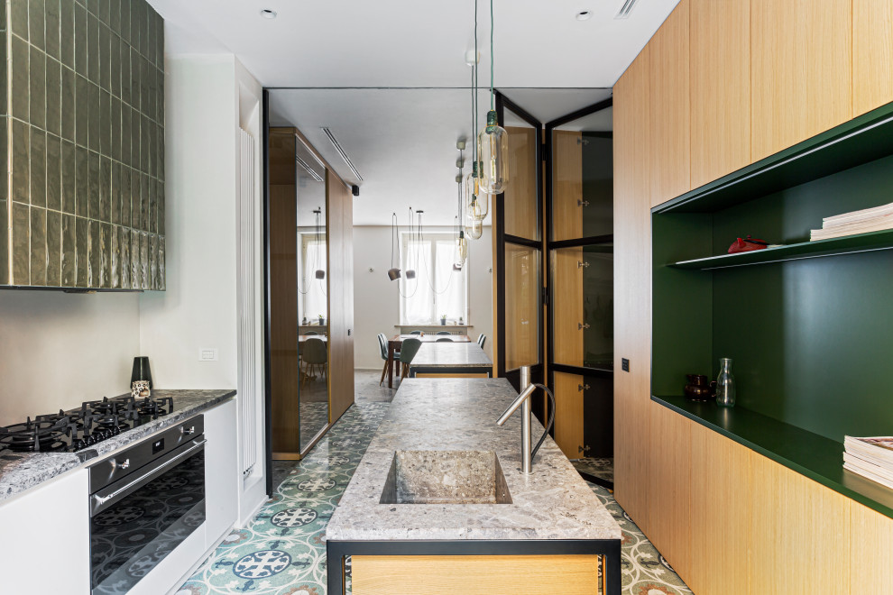 This is an example of a large modern galley eat-in kitchen in Milan with an integrated sink, beaded inset cabinets, light wood cabinets, marble benchtops, stainless steel appliances, marble floors, multiple islands, multi-coloured floor and grey benchtop.