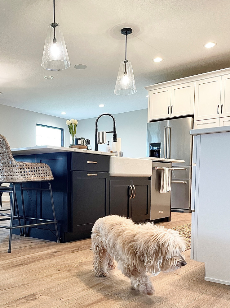 White, Black, and White Oak Open Concept Kitchen and Pantry in
