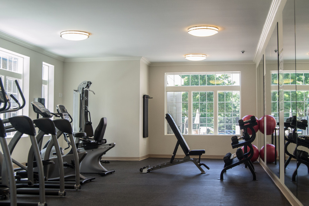 Mid-sized transitional multipurpose gym in Boston with white walls and cork floors.