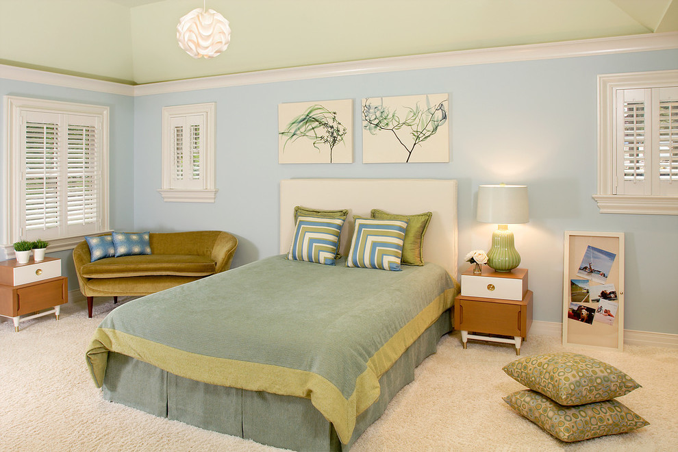 Inspiration for a mid-sized transitional bedroom in New York with blue walls, carpet and beige floor.