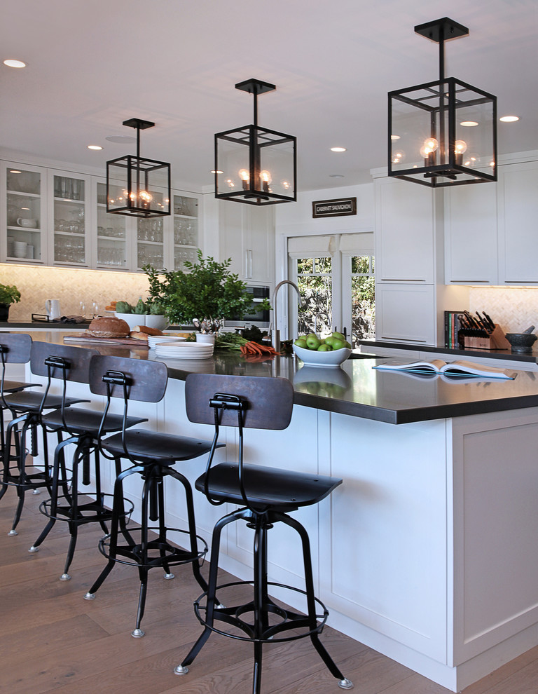 Kitchen - transitional medium tone wood floor kitchen idea in Orange County with flat-panel cabinets, white cabinets and an island