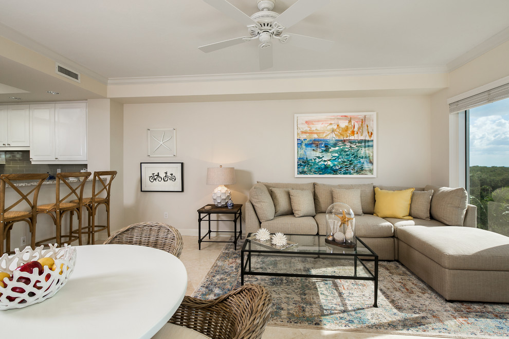 Design ideas for a mid-sized beach style open concept living room in Tampa with travertine floors and beige walls.