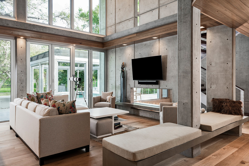 Contemporary living room in Tampa with a wall-mounted tv.