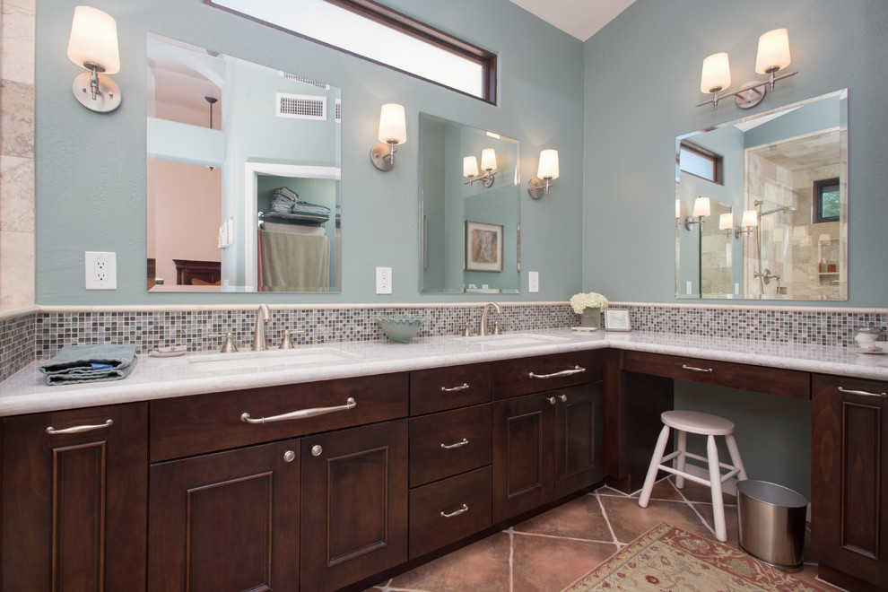 Large transitional master gray tile and stone tile ceramic tile walk-in shower photo in Phoenix with raised-panel cabinets, dark wood cabinets, blue walls, an undermount sink and granite countertops