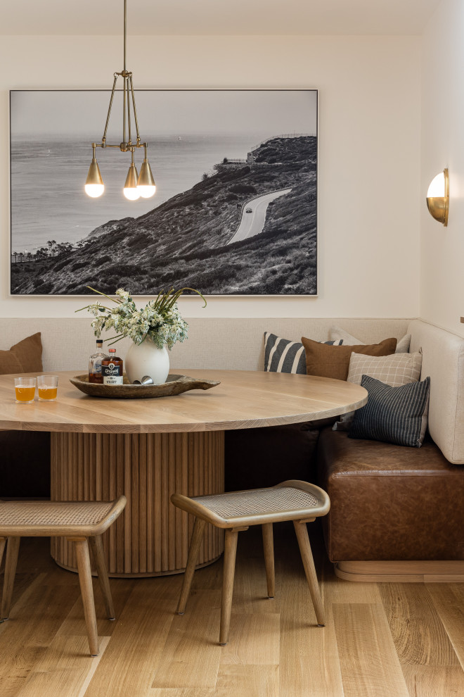 Flint Hills - Transitional light wood floor and beige floor dining room photo in Orange County with white walls