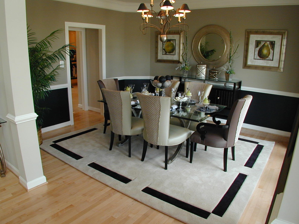 Design ideas for a traditional dining room in DC Metro with beige walls and light hardwood floors.