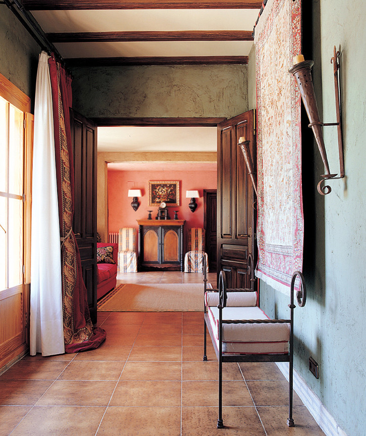 Inspiration for a mid-sized timeless terra-cotta tile hallway remodel in Other with gray walls