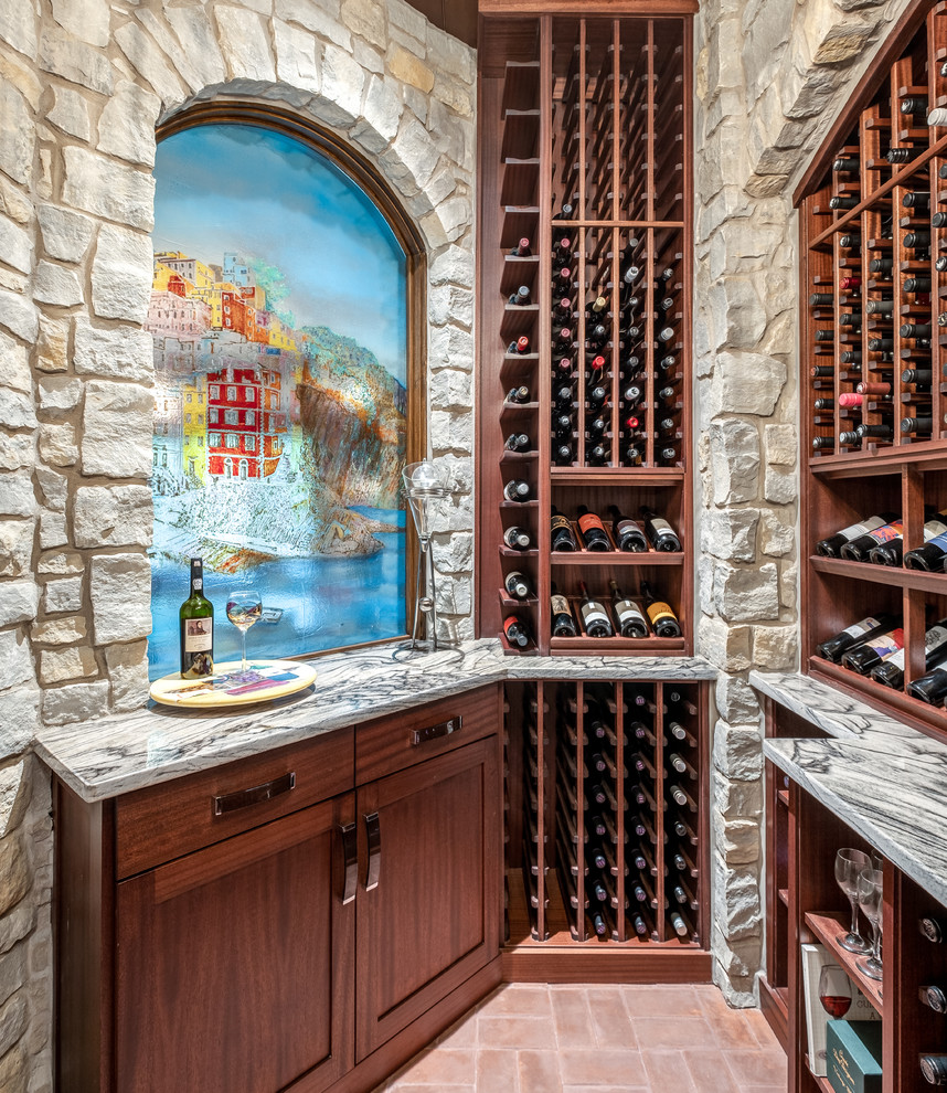 Design ideas for a mediterranean wine cellar in Indianapolis with brick floors, storage racks and brown floor.