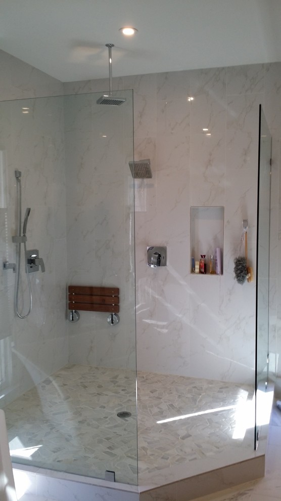 Photo of a large modern master bathroom in Atlanta with a freestanding tub, an alcove shower, a two-piece toilet, white tile, white walls and an undermount sink.