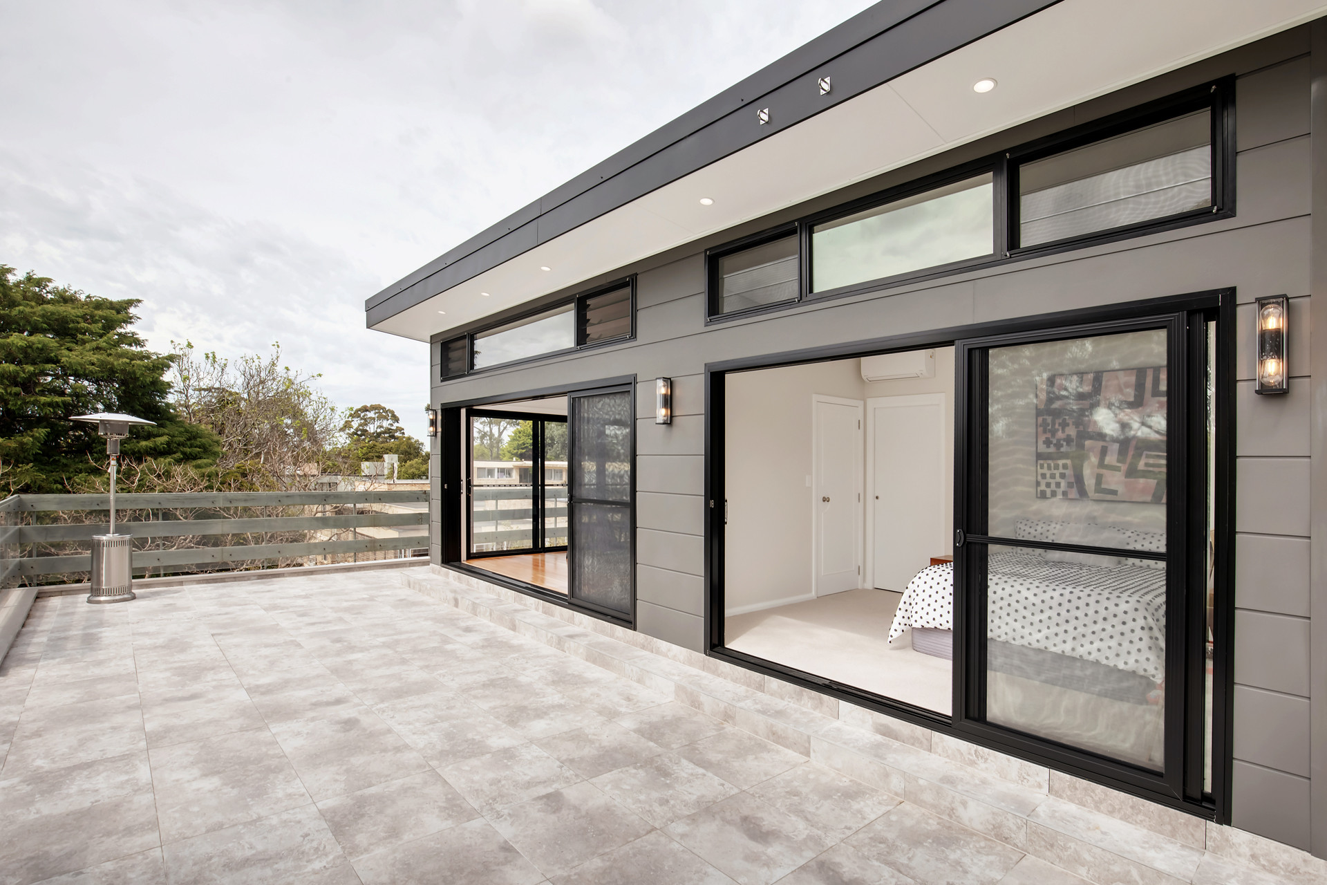 Modern extension with bush view