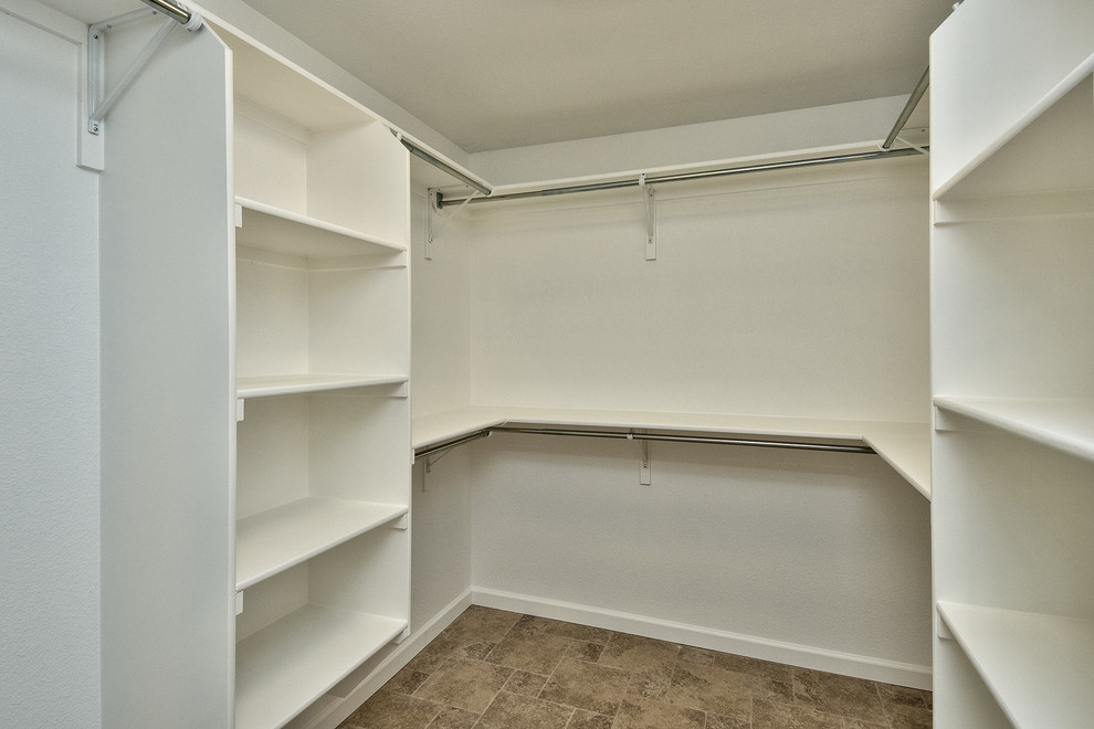 Photo of a mid-sized country walk-in wardrobe in Denver.