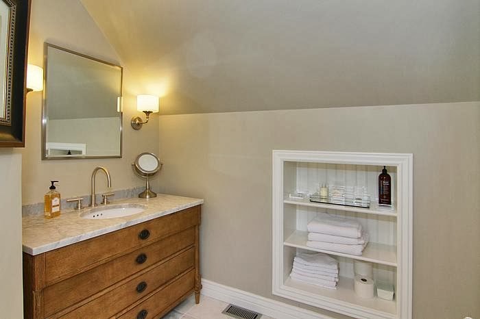 This is an example of a mid-sized transitional 3/4 bathroom in Salt Lake City with an undermount sink, furniture-like cabinets, marble benchtops, white tile, ceramic tile, grey walls, ceramic floors and medium wood cabinets.